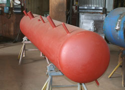 High pressure ammonia and freon receivers for refrigerant liquid storage.